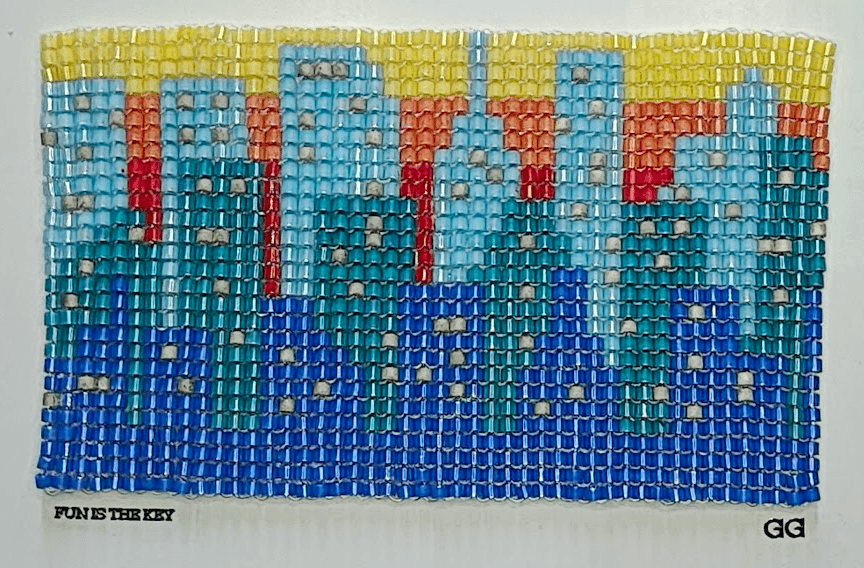 Cidade em pixel art com miçanga